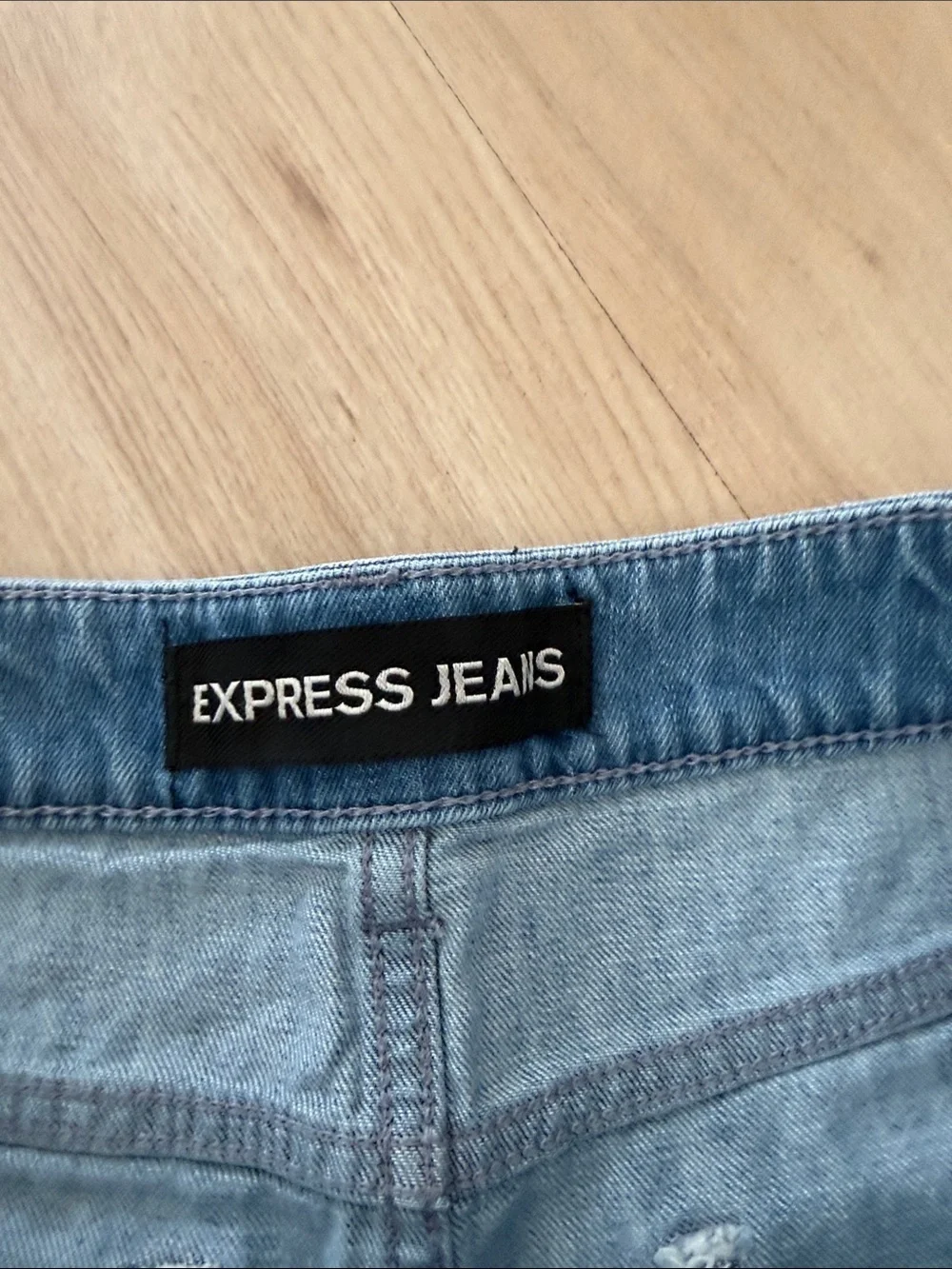 Express Light Blue Distressed Denim Shorts with Striped Underlay